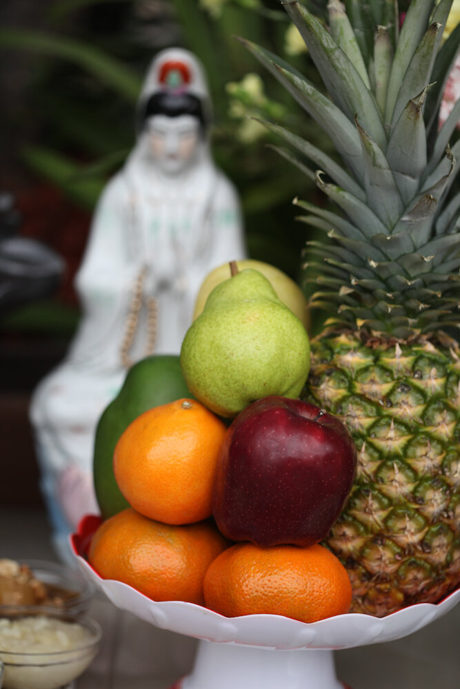 Fruits like this began showing up in front of the Buddha. PHOTO CREDIT: Tom Levy