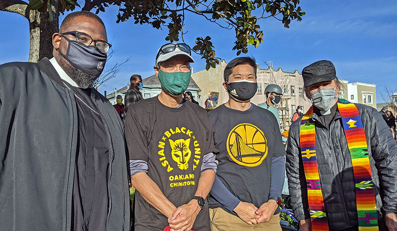 Russell Jeung ( second from left) gathers with neighbors for a rally at San Francisco’s City Hall, to protest violence against Asian Americans.
