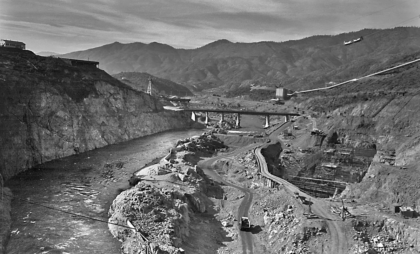 Shasta County — Shasta Dam under construction, looking down the Sacramento River. 1940. Rusell Lee/Farm Security Administration. Archive: Office of War Information Photograph Collection (Library of Congress)