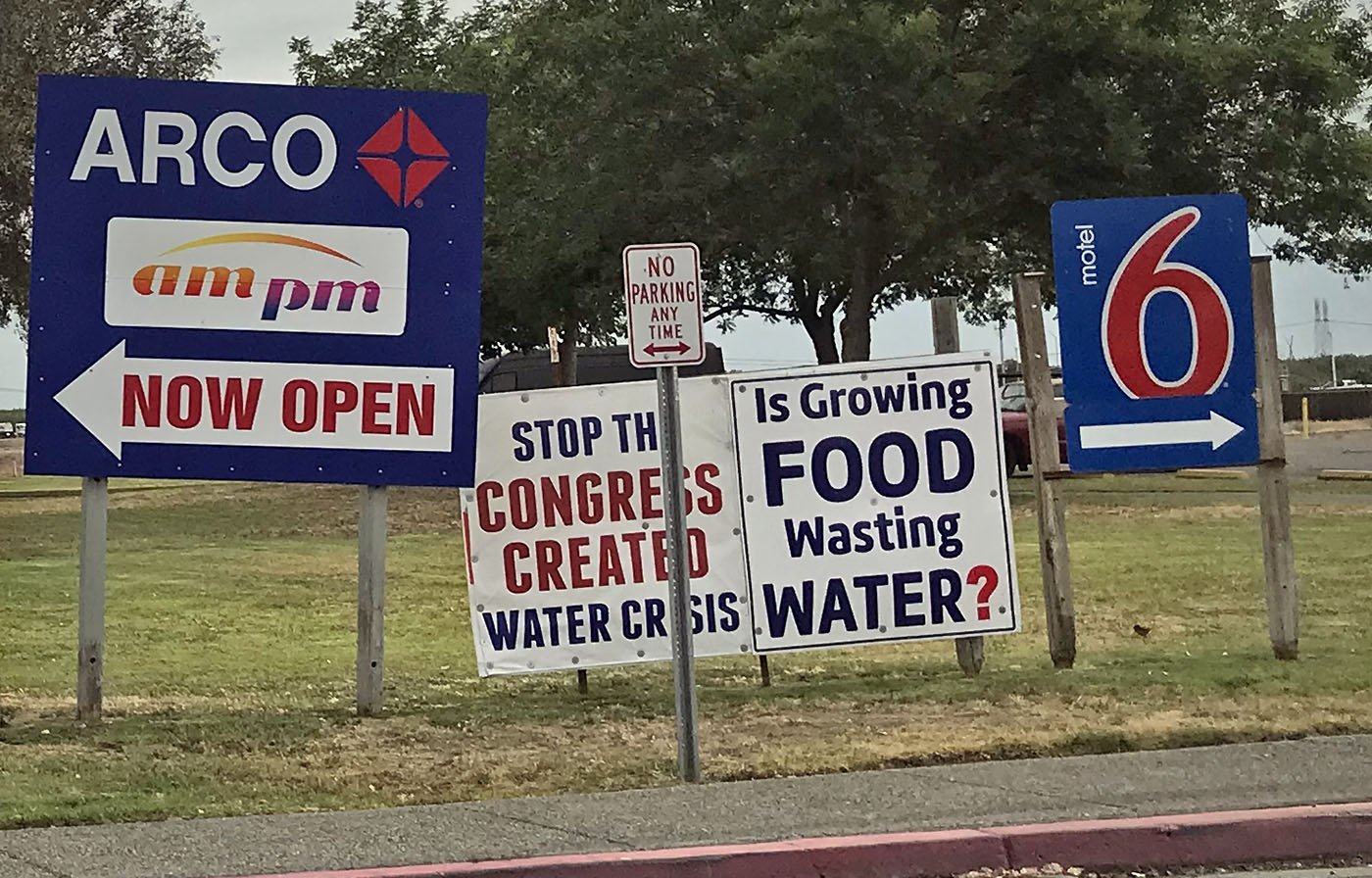  Signs along Highway 5 near Coalinga, CA display local opinions about water distribution. June 17, 2022. Judy Silber/The Spiritual Edge 